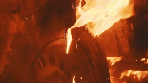 Flaming wreckage of damaged car falling on wheel and ground Stock Footage 203816767