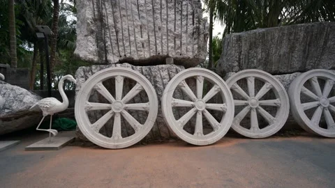Flamingo statues, large stones, large concrete wheels. Near Big Buddha Phuket Stock Footage 153731451