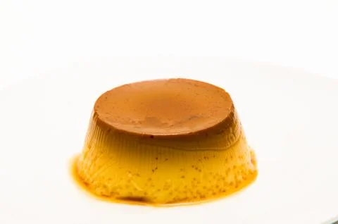 Flan on white background Photos