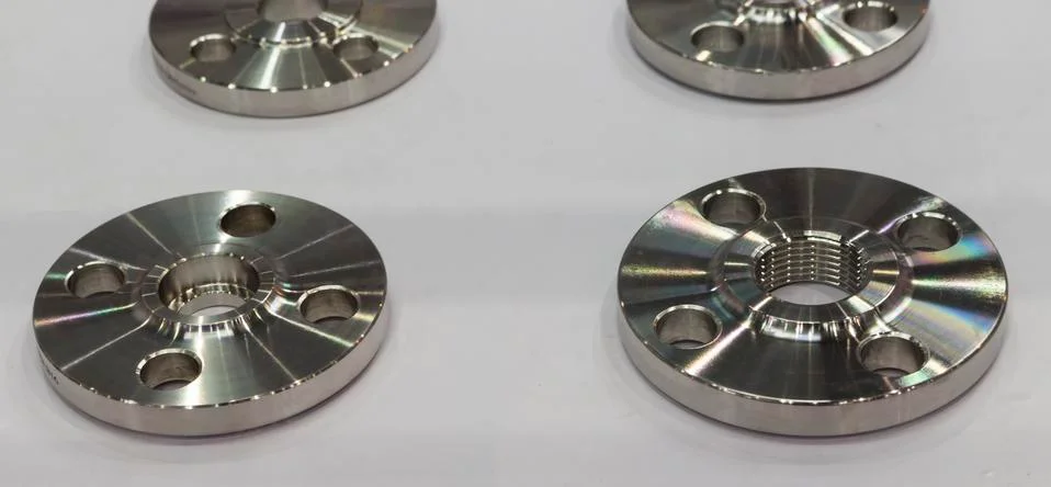 Flange part for pump manufacturing by high accuracy cnc. Stock Photos