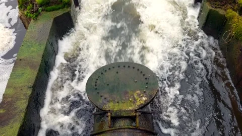 Flap valve swings while water flows through a pipe Stock Footage 270380341