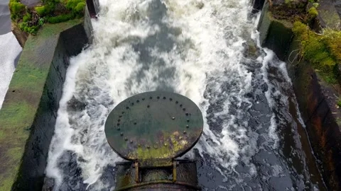 Flap valve swings while water flows. Video stock 271579975