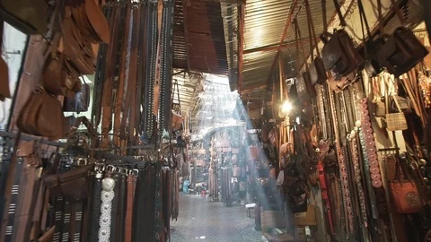 Flare and light rays in the souk of Marrakech Morocco moving forward Stock Footage 87457414