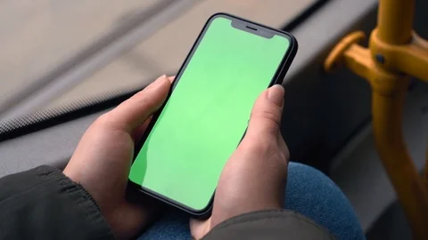 Flare effect. Slow motion. Smartphone with a green screen. A ride in public tran Stock Footage 127485204