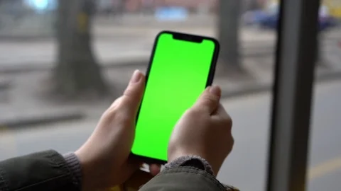 Flare effect. Slow motion. Smartphone with a green screen. A ride in public tran Stock Footage 127485211