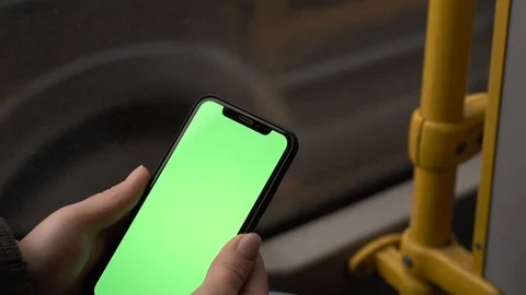 Flare effect. Slow motion. Smartphone with a green screen. A ride in public tran Stock Footage 127485374