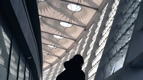 Flare effect. Slow motion. Urban city. A leaving guy in a jacket. Stock Footage 127485328