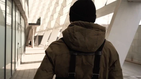 Flare effect. Slow motion. Urban city. A leaving guy in a jacket. Stock Footage 127485372