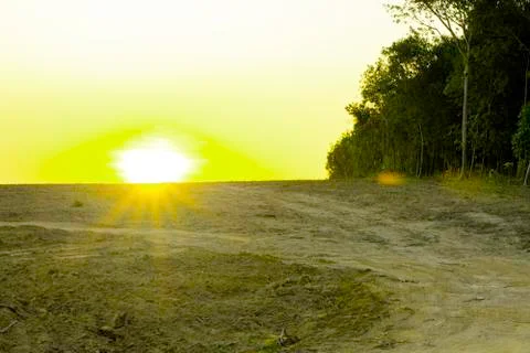 Flare light of sunset over the high the hill, Beautiful dramatic sunset on th Stock Photos