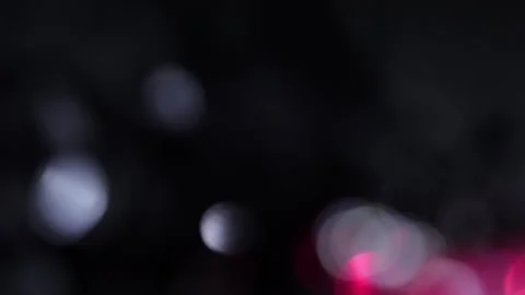 Flare of medium white and red bokeh lights in the dark 库存影片 318673955