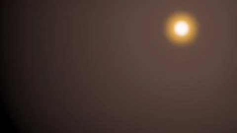 Flare overlay light orange sun glow isolated on black background, realistic o Stock Illustration