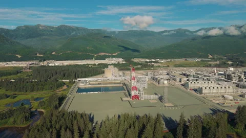 The flare stack and storage tank of a LNG plant in British Columbia Stock Footage 318008571
