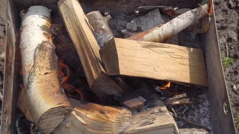 Flaring up barbecue grill fire from birch wood Stock Footage 89970572