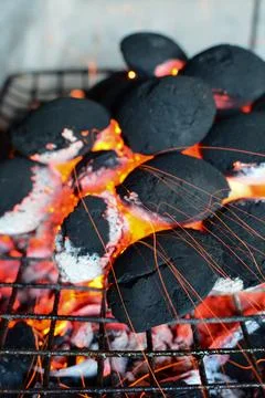 Flaring up of barbeque coal Stock Photos