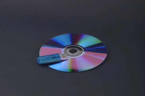 Flash card lying on a disk on a dark grey background Stock Photos