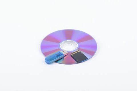 Flash card lying on a disk on a dark grey background Stock Photos