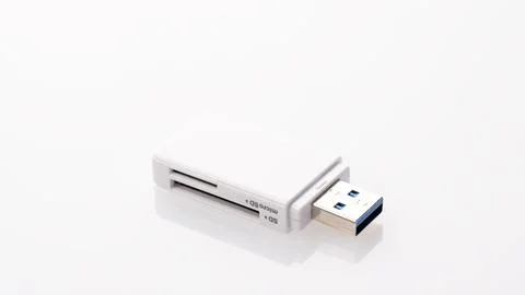 Flash card reader on white background Close-up, adapter SD to USB, microSD .. Stock Photos