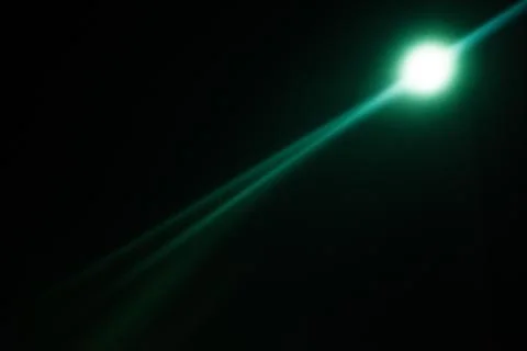 Flash of a distant abstract star. Abstract sun flare. The lens flare is subje Stock Photos
