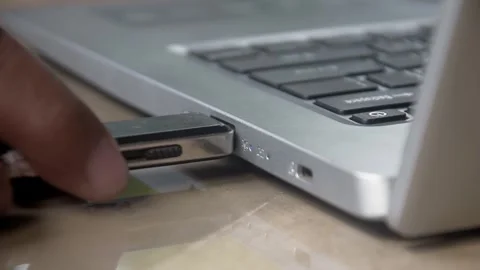 Flash drive is connected to the laptop via the USB port Stock Footage 347641376