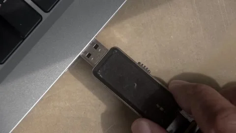 Flash drive is connected to the laptop via the USB port Stock Footage 347641380