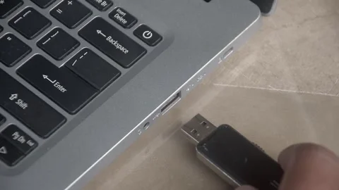 Flash drive is connected to the laptop via the USB port Stock Footage 347641400