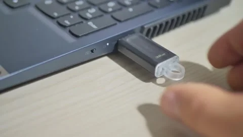The flash drive is removed from the laptop, a close-up shot of Dolly. Stock Footage 255615304