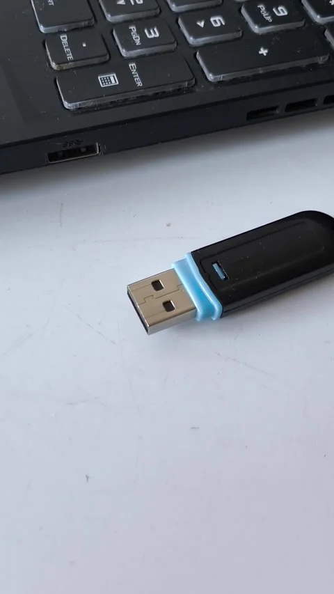 Flash drive on the table near the laptop keyboard. Storing data on a flash drive Video stock 320523798