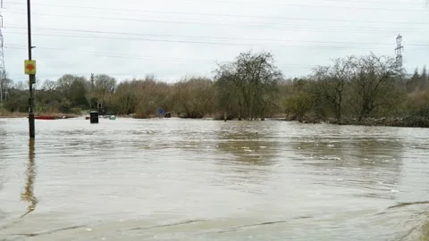Flash flood disaster after heavy rain overflowing river banks and submerging Video stock 331159608