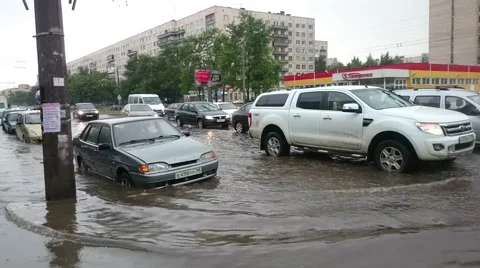 Flash Flood. A Vehicle Ploughs Driving  Through Flood Water. Russia Stock Footage