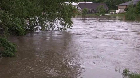 Flash flooding after severe thunderstorms and heavy rain in Grand Valley Canada Stock Footage