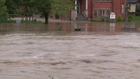 Flash floods after severe thunderstorms and heavy rain in Grand Valley Canada Stock Footage