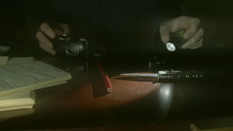 Flash Light Beam, Penknife, Gloved Hand, (forensic scrutiny) Stock Footage 252605856