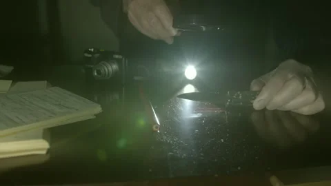 Flash Light Beam, Penknife, Gloved Hand, Magnifier Glass, Photography Stock Footage 252606615