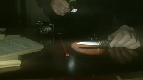 Flash Light Beam, Penknife, Gloved Hand, (forensic scrutiny) Stock Footage 252609582