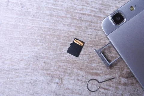 Flash memory data storage concept : A tray with a micro SD card on white back Stock Photos