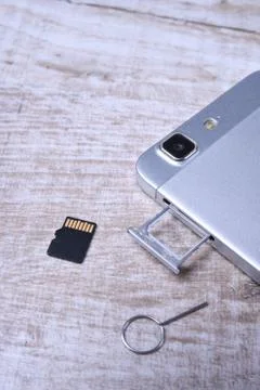 Flash memory data storage concept : A tray with a micro SD card on white back Stock Photos