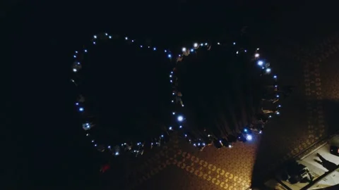 Flash mob figure 8, people waving flashlights, aerial photography 스톡 동영상 200981142