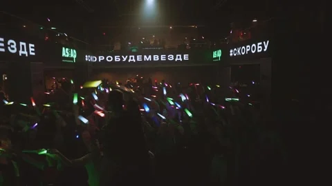 Flash mob, flash mob with glowing sticks, flash mob in the club Stock Footage 285909195