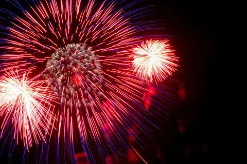 Flash of red and white fireworks on background black sky. Concept of holiday Stock Illustration