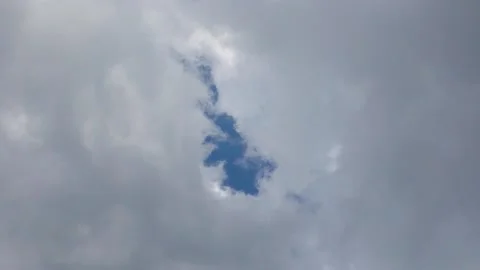 Flash of sky in the clouds Stock Footage 165387049