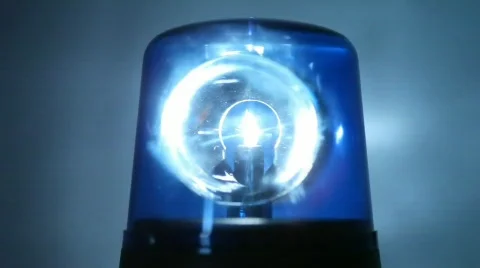 Flasher rotates rapidly in dark and  illuminates wall behind it with bright Stock Footage 772870