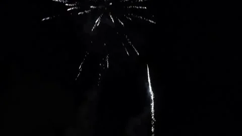 Flashes of fireworks in the night sky. Stock Footage 132248502