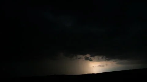 Flashes of lightning in the night sky among thunderclouds. Stock Footage 279689490