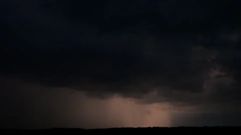 Flashes of lightning in the night sky among thunderclouds. Stock Footage 279689841