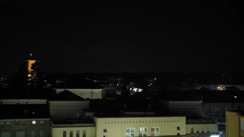 Flashes of lightning over the city at night during a powerful thunderstorm Stock Footage 246555443