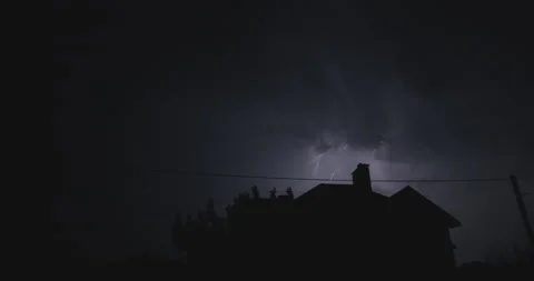 Flashes of lightning over the night street illuminate the house. Strong storm Stock Footage 196312454