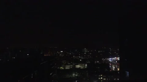 Flashes of lightning as severe thunder storm approaches city from a distance Stock Footage 237615069