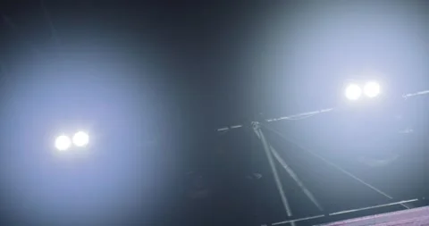 Flashing and rotating light beams from stage lights on a construction durin.. Stock Footage 245493976