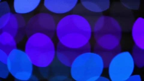Flashing bokeh lights blinking in dark. closeup. Stock Footage 318938921