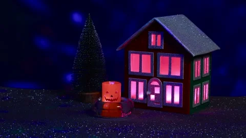 Flashing candle between house multicolored flashing light in windows and tree Stock Footage 288284450
